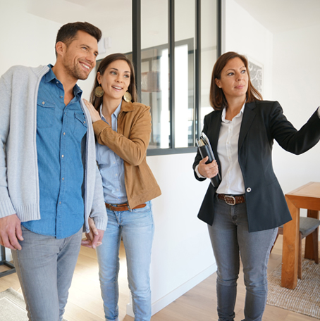 Real estate agent showing couple a new home