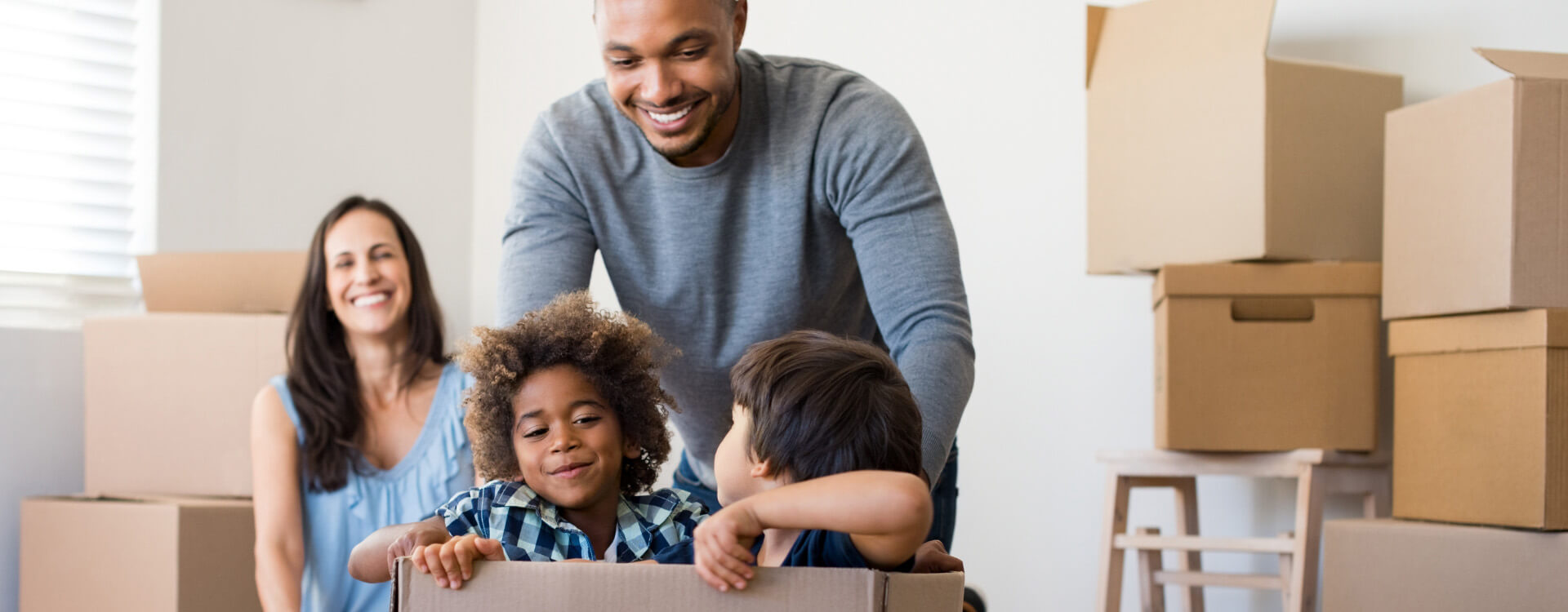 Happy family moving in to their new home.